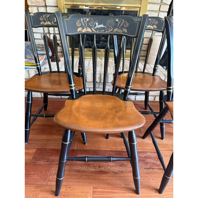 A rare and complete set of four (4) Ethan Allen dining chairs featuring the highly collectible "Deer and Willow" stencil...