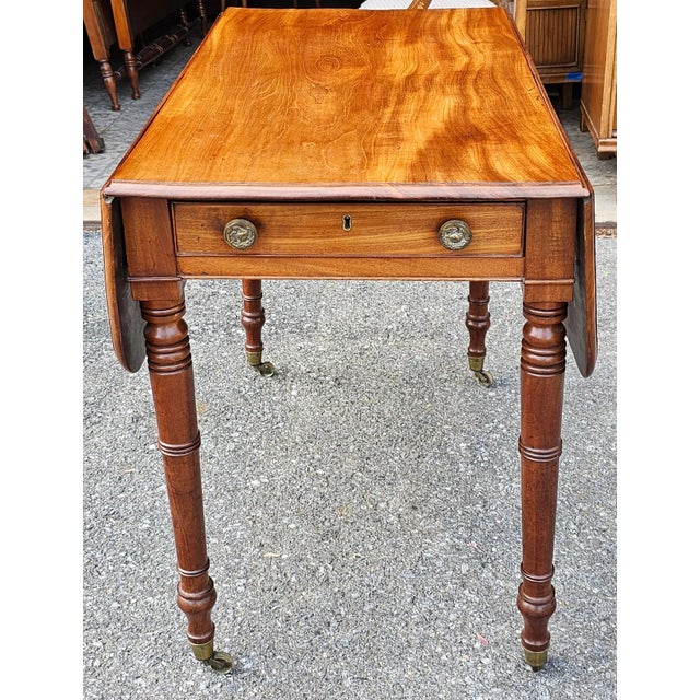 Late Federal Mixed Fruitwood Single Drawer Dropleaf Pembroke Table on wheels. The back of the table look exactly as the...