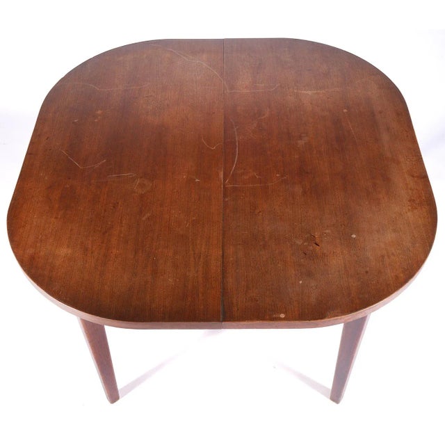 Jens Risom 1950's walnut rectangular dining table includes two leaves for expansion. The table measures 29.5" H X 42.25" D...