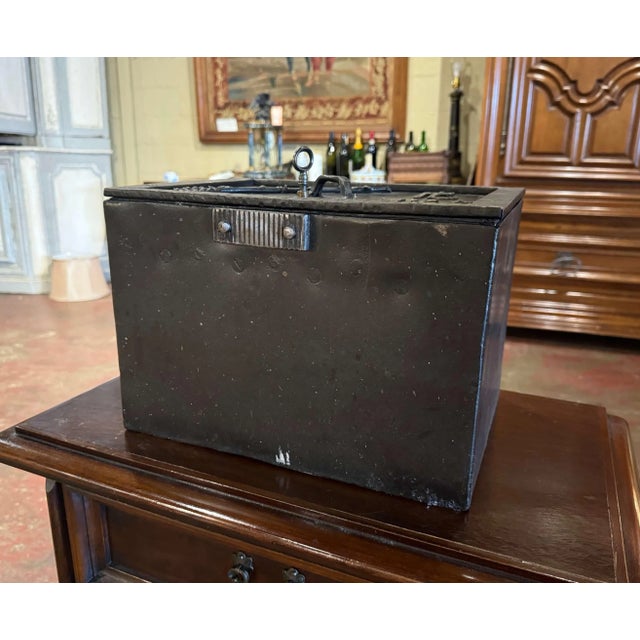 Add a touch of history and character to an office, study, or library with this unusual antique cast iron strongbox....