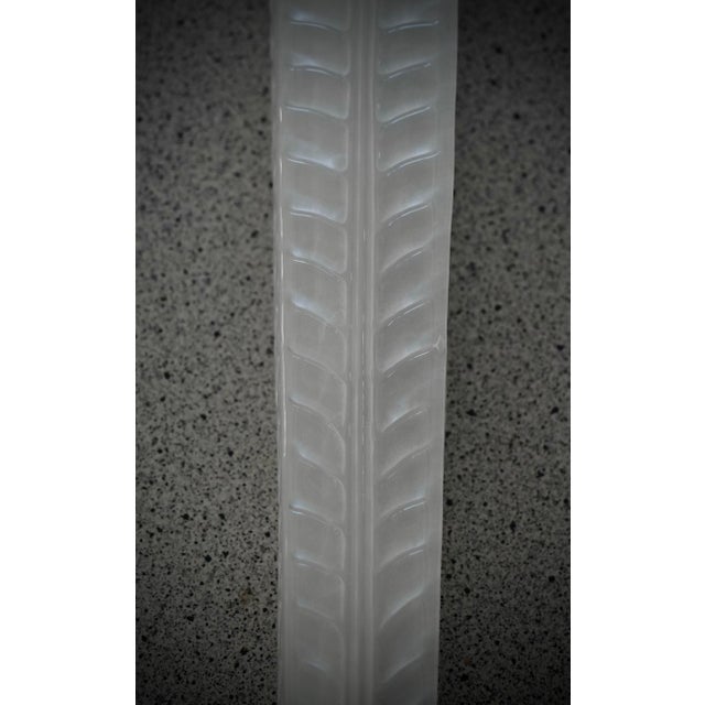 A highly original Murano glass wall light with an extremely elongated design of glass leaves in a unique, clear...