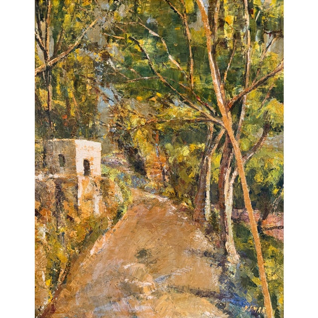 Warm and vibrant European landscape of a pathway in a wood with a building in the background. Rich and earthy color...