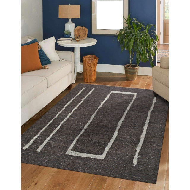 Talia Delicate Brown Flatweave Wool Rug, Country of Origin: India. This exceptional flatweave piece showcases the refined...