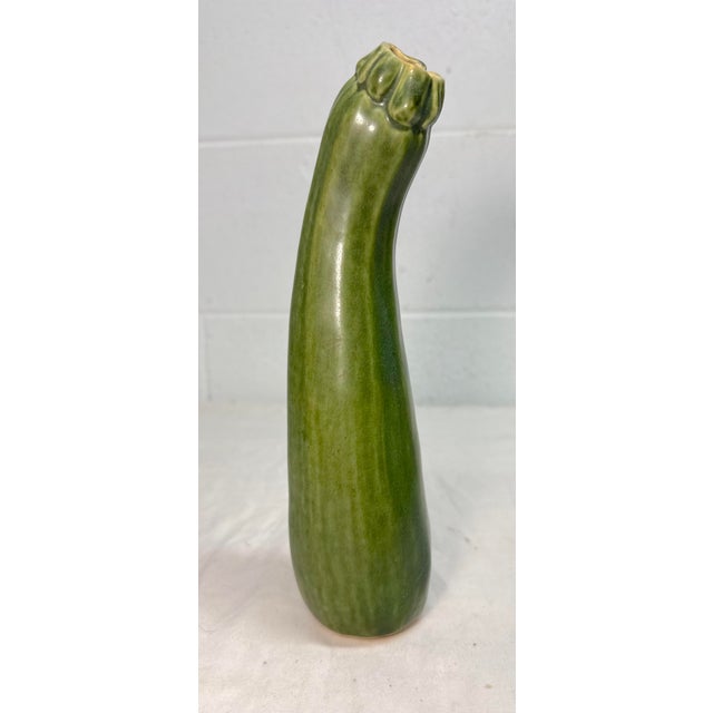 This vintage handmade Patricia Garrett figural tall zucchini pottery vase done in 1997 is a unique addition to any...