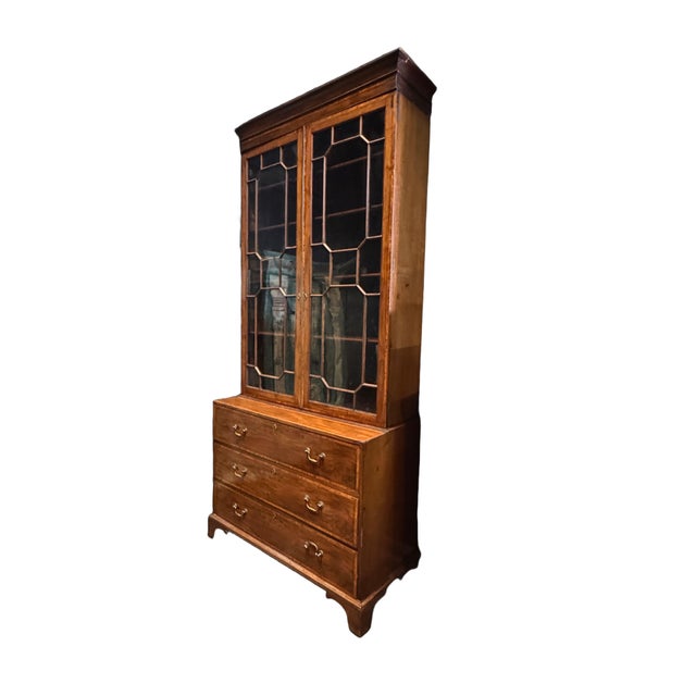 A handsome antique English Georgian mahogany bureau bookcase dating to the late 18th century, beautifully combining...