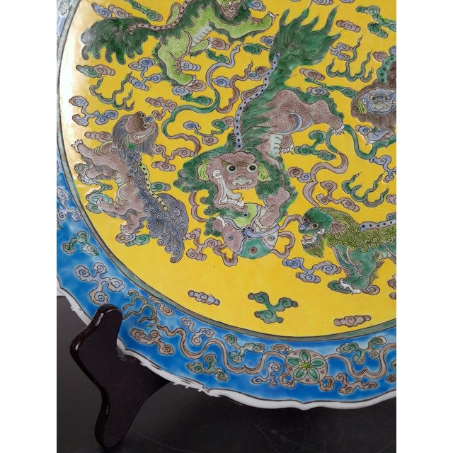 Chinese porcelain five shishis charger, a large, finely formed, a large, finely formed, serving plate with a polychrome,...