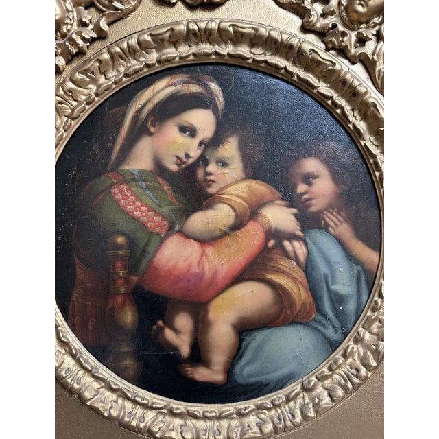 A fine Italian 19th Century Oil Painting on canvas. “La Madonna della Seggiola” after Raphael. This painting is a 19th...