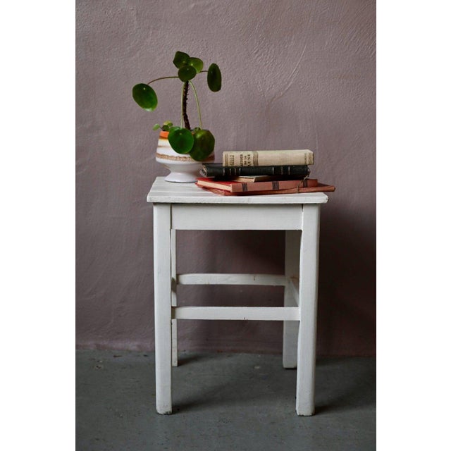 This cute little stool dates back to the 1950s. Made entirely of wood, the white paint has a patina from age and use. It...