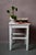 This cute little stool dates back to the 1950s. Made entirely of wood, the white paint has a patina from age and use. It...