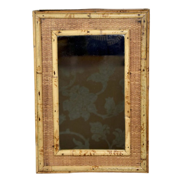 Delightful vintage Coastal style tortoise bamboo caned wall cabinet with mirror; ready for use.