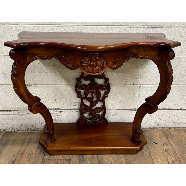 This is a gorgeous vintage carved mahogany serpentine console table, hall table, or entryway table with elements of...