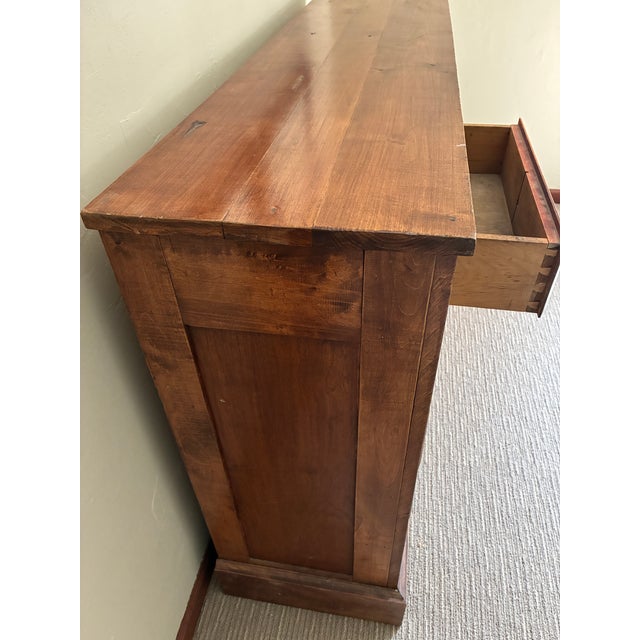 An authentic turn-of-the-century commercial apothecary cabinet, crafted in the early 1900s and historically attributed to...