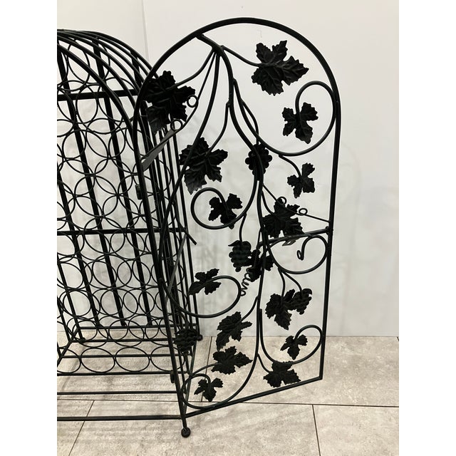 This iron wine rack can store 32 bottles! There is a set up to add your lock if u wish See the photos Nice size H36 W16 D13.5