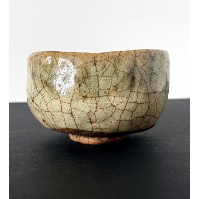 A modern ceramic Chawan (Tea Bowl) by potter Kato Tokuro (1896-1985). The bowl was hand-molded in the classic Han-tsutsu-...