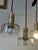 Design Plus Gallery presents the Iris Quatro Linear Pendant in Hand Rubbed Antique Brass With Clear Glass from Visual...