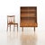 This vintage mid-century china cabinet was produced in England by Turnidge of London during the 1970s. This display...