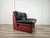 An elegant vintage armchair by Nicoletti Salotti, featuring a distinctive enveloping structure and two-tone genuine...