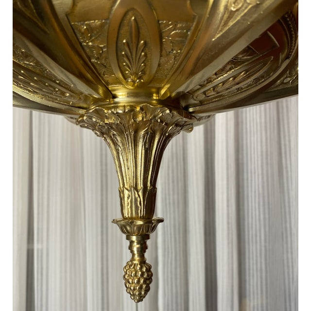 Rare and stunning French Art Deco bronze chandelier with a geometric & floral designs having 6 scroll arms radiating out...
