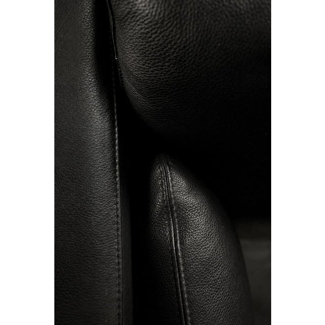 This elegant two-seater sofa was manufactured in Denmark during the 1970s, perfectly combines minimalist form with...