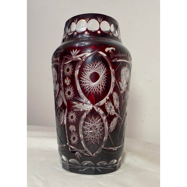 This lovely crystal example features a vibrant deep cranberry red color done in cut to clear style with intricate design...