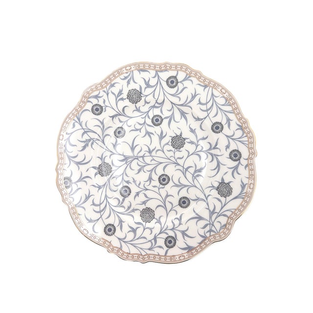 A beautifully detailed set of four porcelain dessert plates by Morris & Co., inspired by the enduring design legacy of...