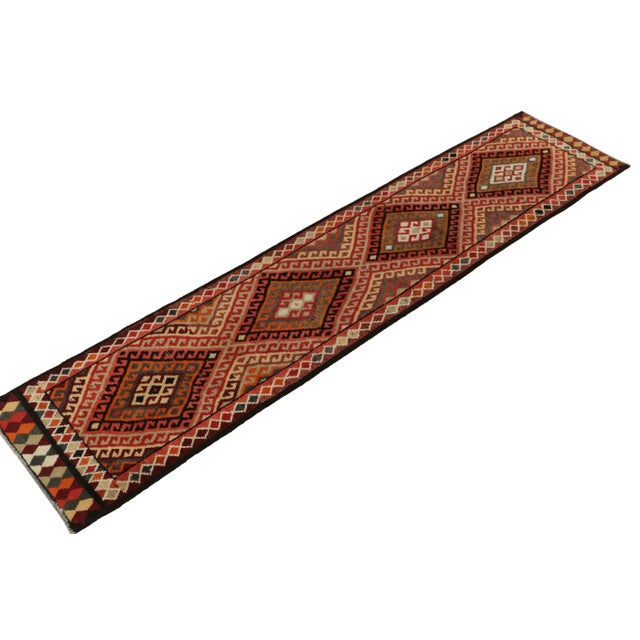 Hand-knotted in wool, a 3x12 runner from Rug & Kilim’s latest curation of rare tribal pieces from the mid-20th century....