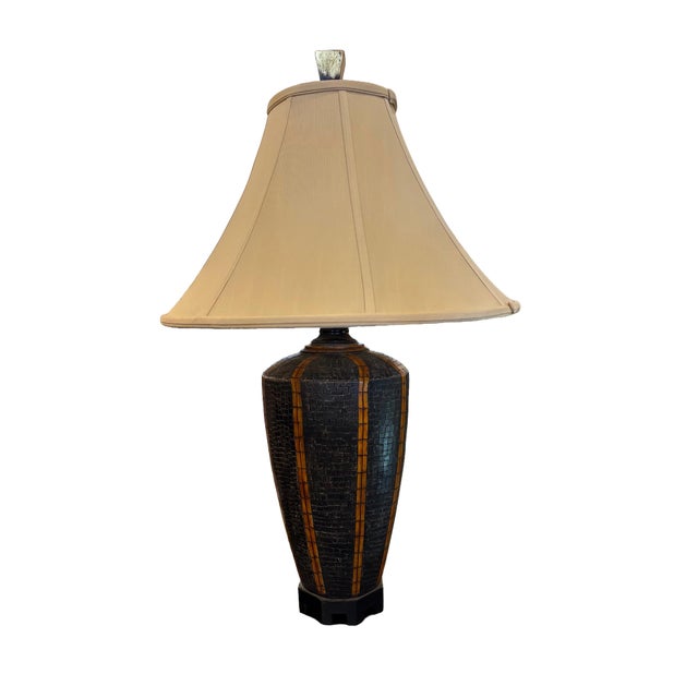 Pair of statement table lamps featuring urn-shaped bases handcrafted with mosaic-tiled dark steer horn panels and...
