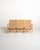 Laminated and curved beech frame, with seats and backrests made of wide woven fabric straps. Original branding present....