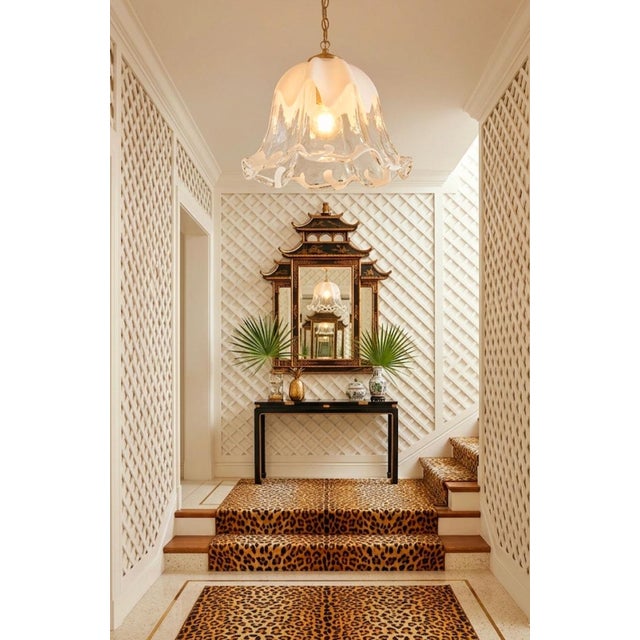 A beautiful Murano clear and white Opaline glass ruffled tulip chandelier light fixture. The fixture features a thick...