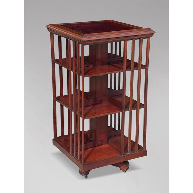 A superb-quality and highly unusual 19th-century French solid mahogany three-tier revolving bookcase, bearing the label of...