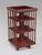 A superb-quality and highly unusual 19th-century French solid mahogany three-tier revolving bookcase, bearing the label of...