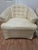 This exceptional matching pair of unbranded Mid-Century Modern swivel barrel chairs beautifully balances iconic atomic-era...