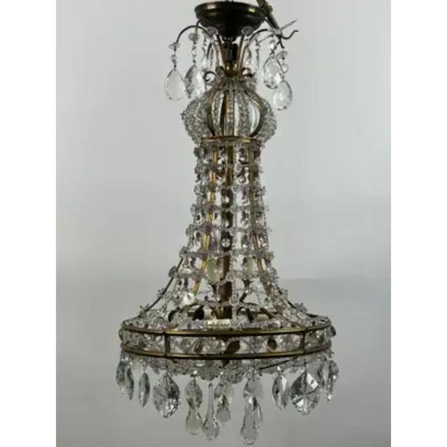 Vintage French Empire Style Gilt Bronze & Tiered Crystal & Beads Chandelier with Amethyst Accents This vintage French...