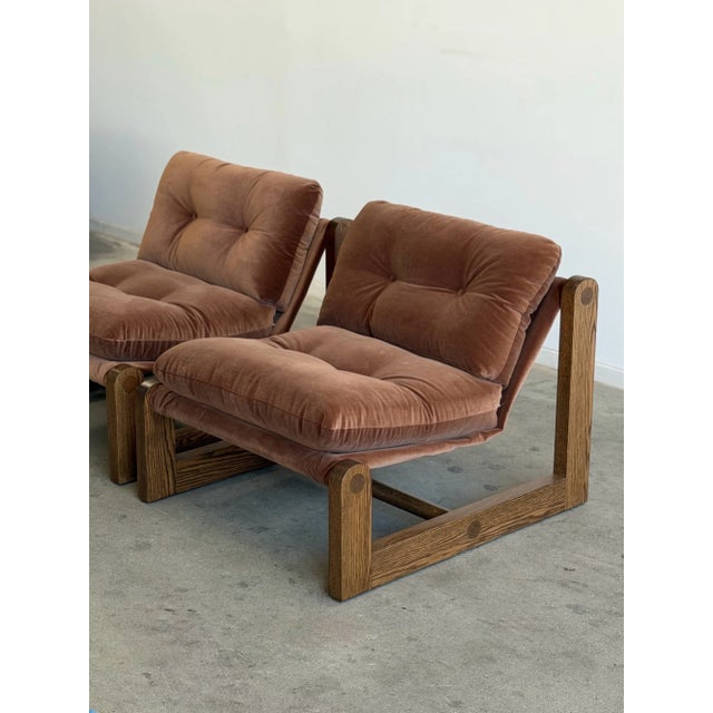 W34 D37 H32 SW28 SD22 SH20 These handcrafted lounge chairs anchored by a bold architectural solid oak base with rounded...