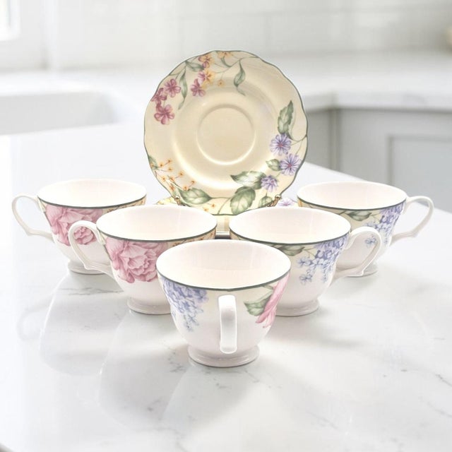 A coordinated ten-piece tea service from the Westbury Court by Jessica McClintock Christina pattern, comprising five...