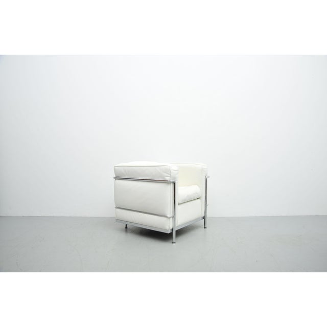 LC2 armchair, designed in 1928 by Le Corbusier, Pierre Jeanneret, and Charlotte Perriand. White leather with a chrome-...