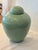 Classic ginger jar in a gorgeous celadon green color, simple domed top. A tiny crack (surface only) shown in detail photo....