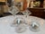 Design Plus Gallery presents a Set of Four Glass Pedestal Vessels + Seashells. Each clear glass vessel has a rounded body,...