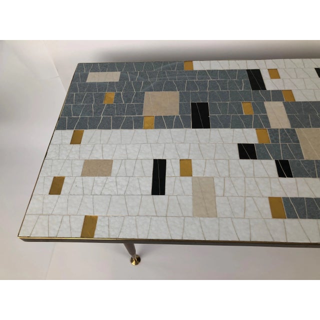 A beautiful Mid-century glass mosaic coffee table from Ilse Möbel, Denmark. This remarkable glass mosaic is in beautiful...