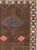 This Mid-20th century Turkish Anatolian room-size carpet presents a disciplined twin-panel composition arranged across a...