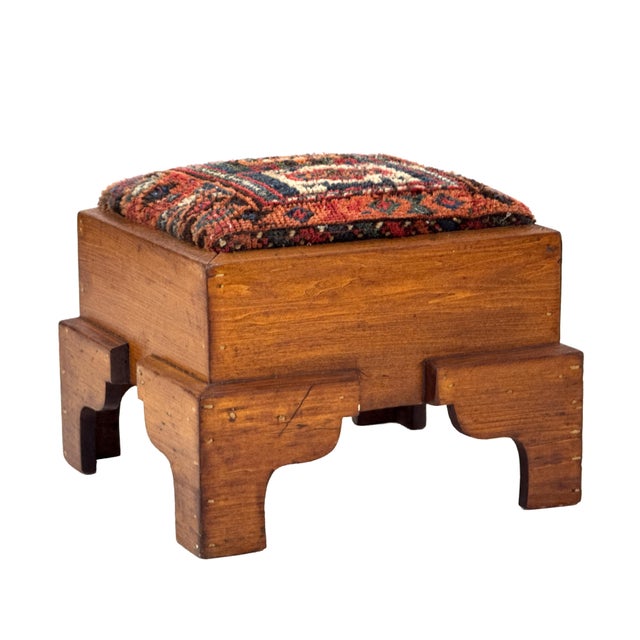 Antique 1920s handcrafted solid oak footstool featuring a thick, architectural frame with chamfered edges, stepped legs,...