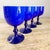 This beautiful set of cobalt hued exterior cased wine glasses, with starkly contrasting white interiors, create a...