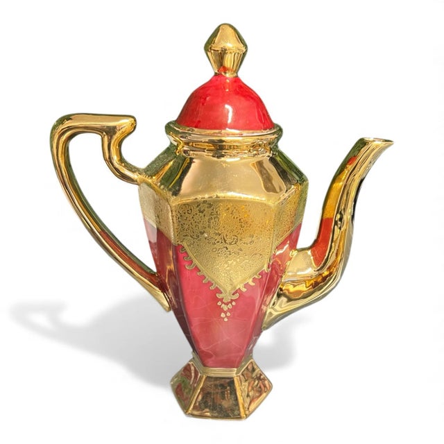 A stunning 15-piece vintage Limoges China espresso/tea service, featuring a bold ruby-red finish, intricate hand-applied...