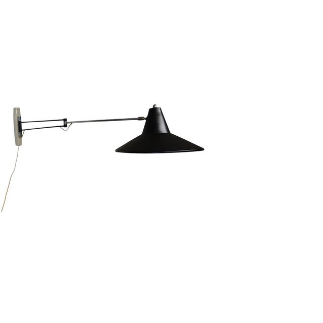 This exceptionally large wall lamp from philips' renowned nx series is an outstanding example of dutch mid-century design...