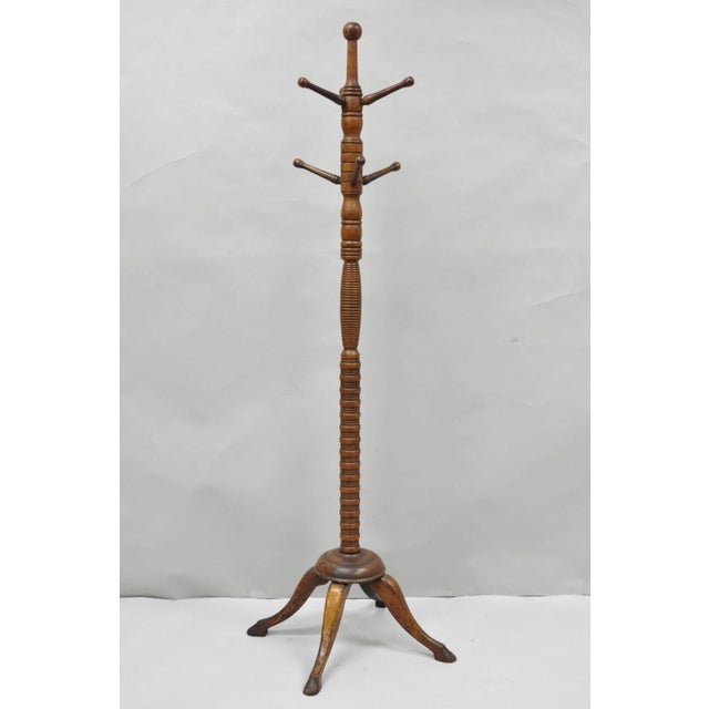 Antique Arts & Crafts Mission Oak Wood Carved Hoof Foot Standing Coat Rack Tree. Circa Early 20th Century. Measurements:...