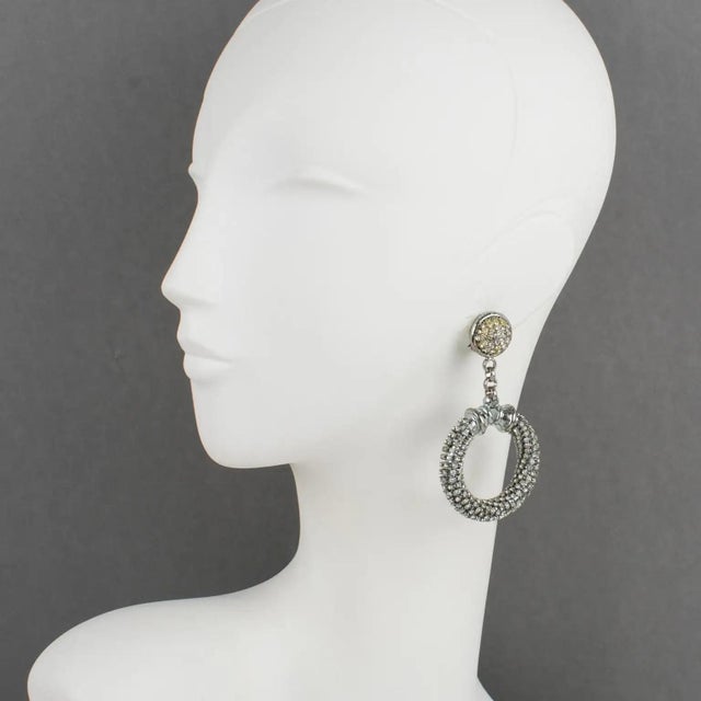 Crafted by iconic Italian designer Gianfranco Ferré, these rare couture clip-on earrings command attention with their...