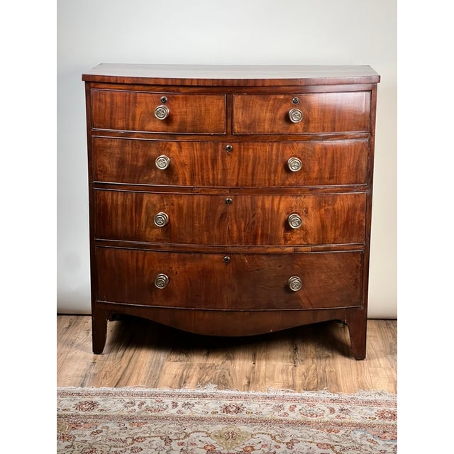This fine antique George III mahogany bowfront chest dates to the late 18th century and is a wonderful example of the...