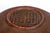 A finely woven antique Chinese reddish-brown lacquered rattan basket with a tall arched handle, lid, round body and small...