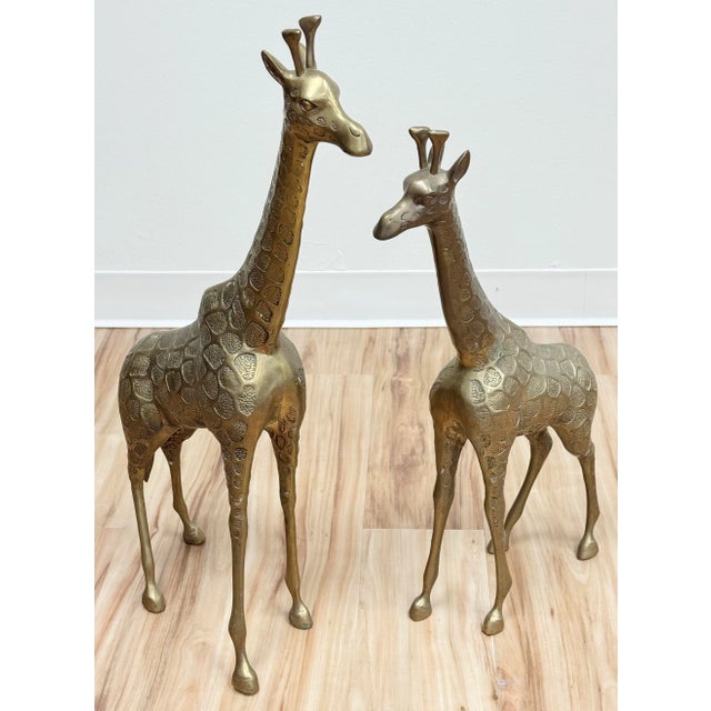 Vintage pair of stately brass giraffe statues. Wonderful design detail with great presence! Large measures 5.5" W x 15.5"...