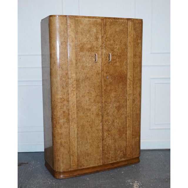 Beautiful Art Deco Blonde Walnut Two Door Wardrobe. A very good quality piece of furniture, designed in blonde walnut and...